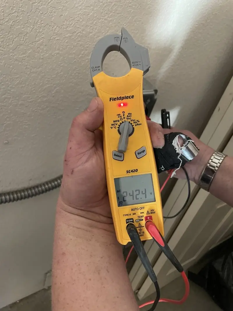 Voltage testing with clamp meter during Generator Installation in Randolph Town